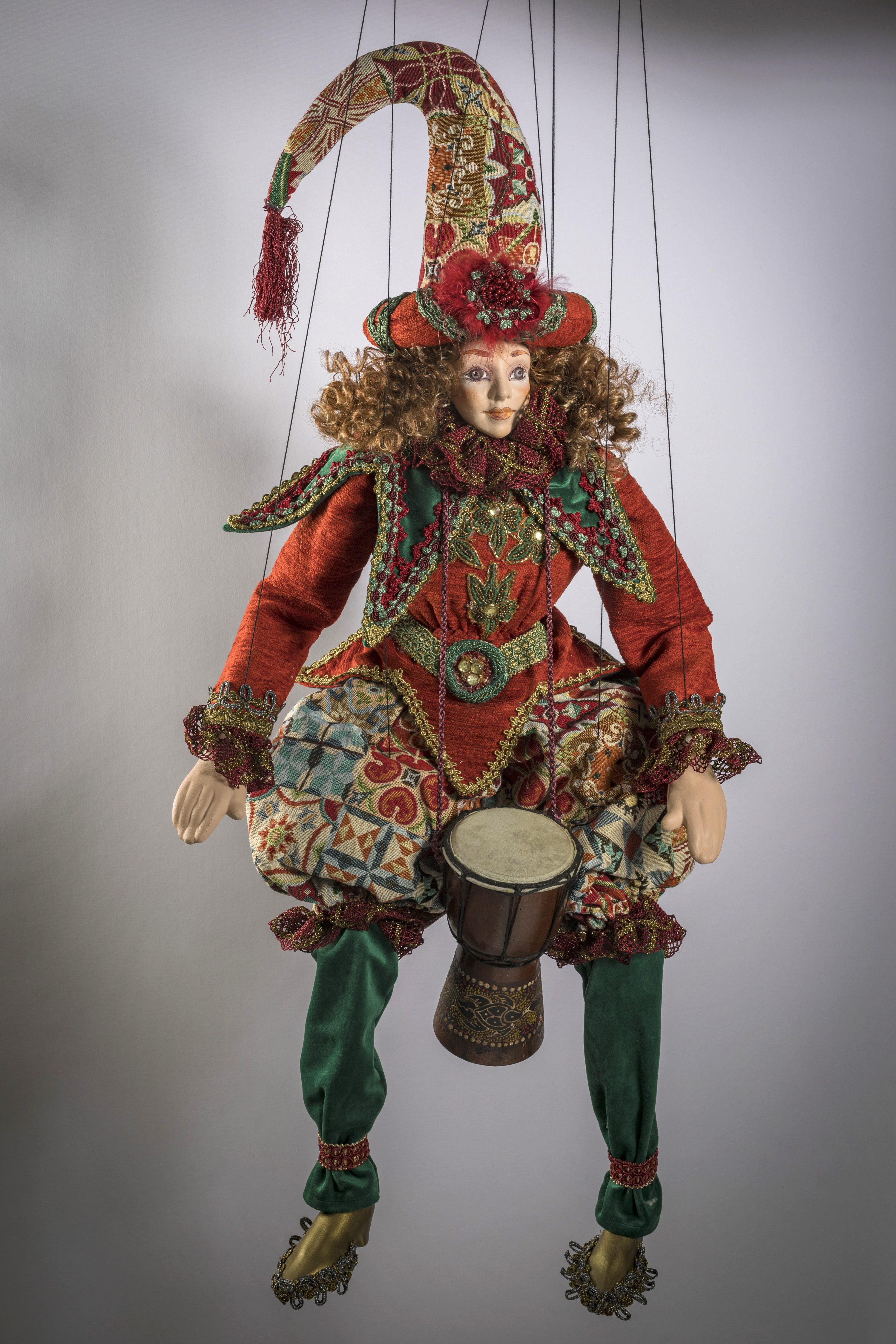 The Drummer is handmade marionette by Vasiliki Savvani She uses different fabrics every detail is hand-sewn, face, hands and feets made by ceramic. His face is hand painted by acrilyc paints.