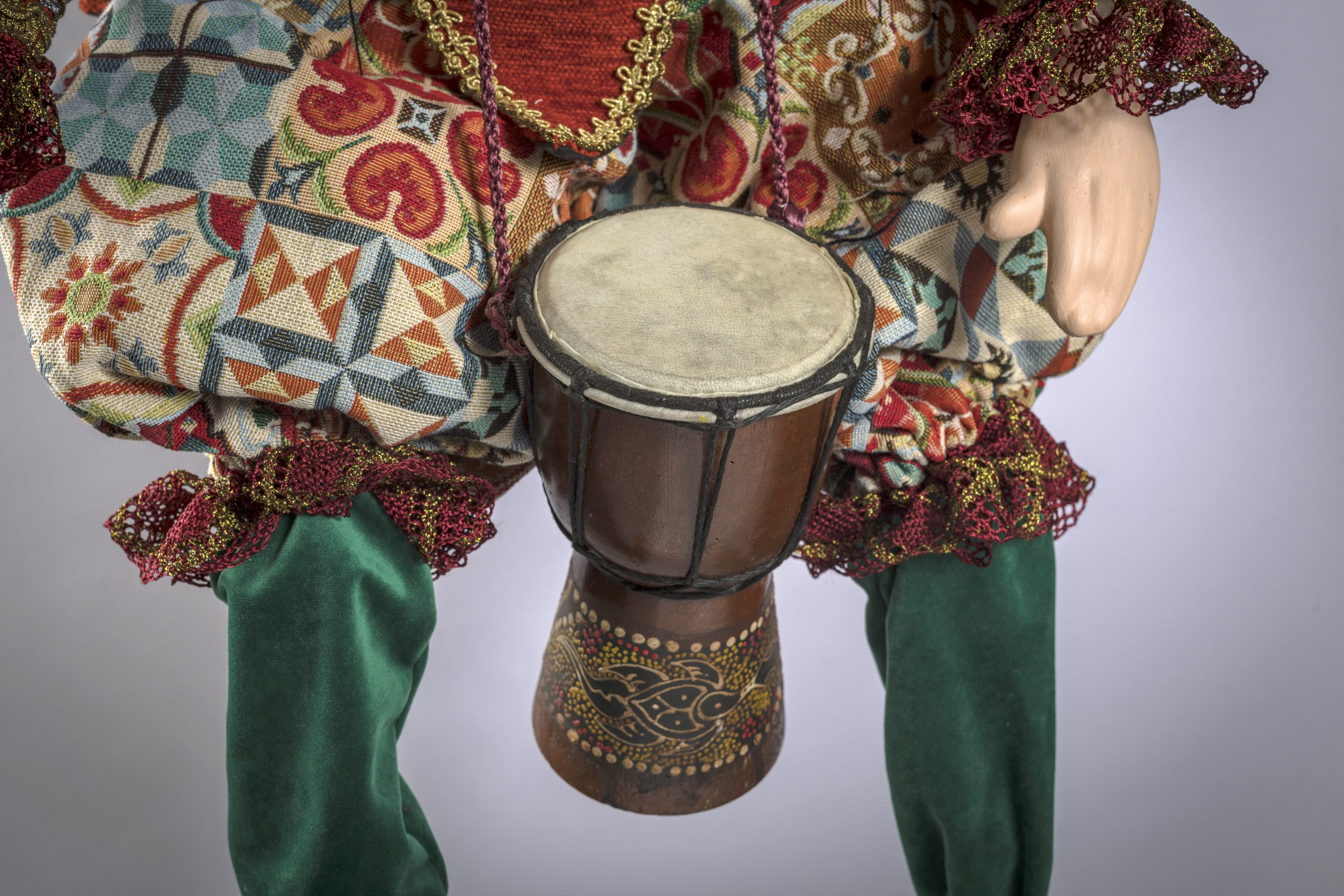 The Drummer is handmade marionette by Vasiliki Savvani She uses different fabrics every detail is hand-sewn, face, hands and feets made by ceramic. His face is hand painted by acrilyc paints.